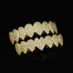 picture: heart-shaped pointed gold upper and lower teeth