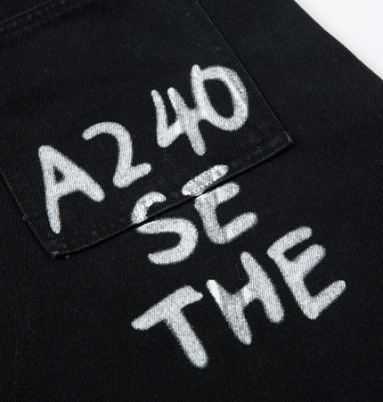 THETLSTUDIO Trendy street letter graffiti patch leopard print fake two pieces of design scimitar wide-leg hip-hop jeans for men and women
